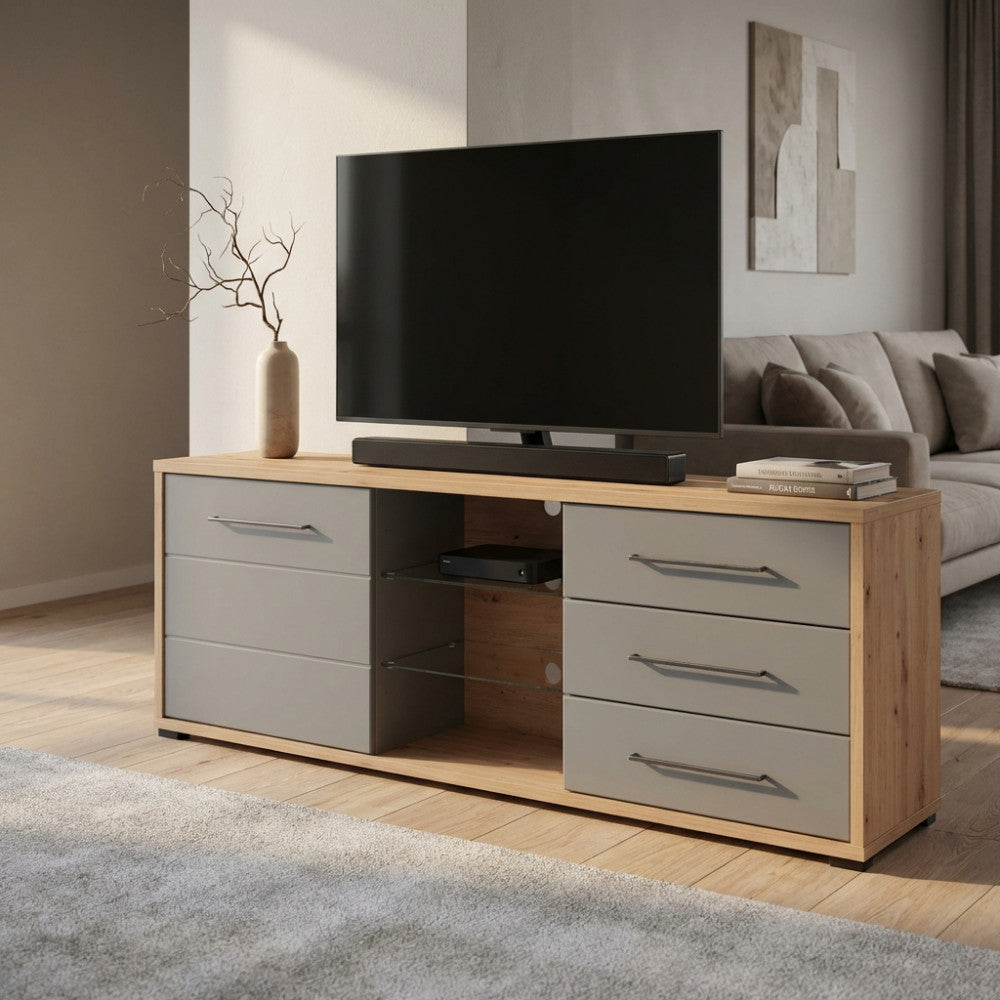 Porta TV Lisabon in rovere e grigio grafite ambientato in un luminoso soggiorno moderno con televisore.