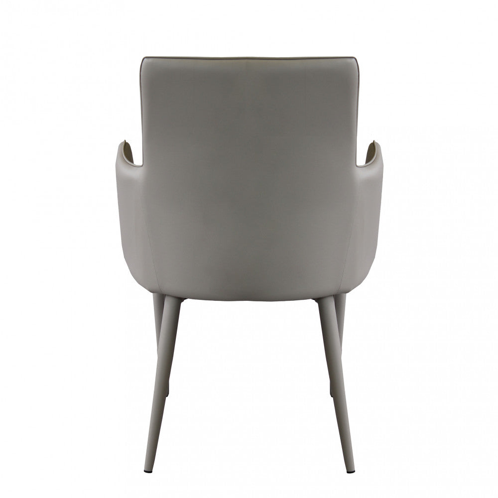 Poltrona Camille con braccioli e seduta imbottita in ecopelle color tortora, vista dal retro