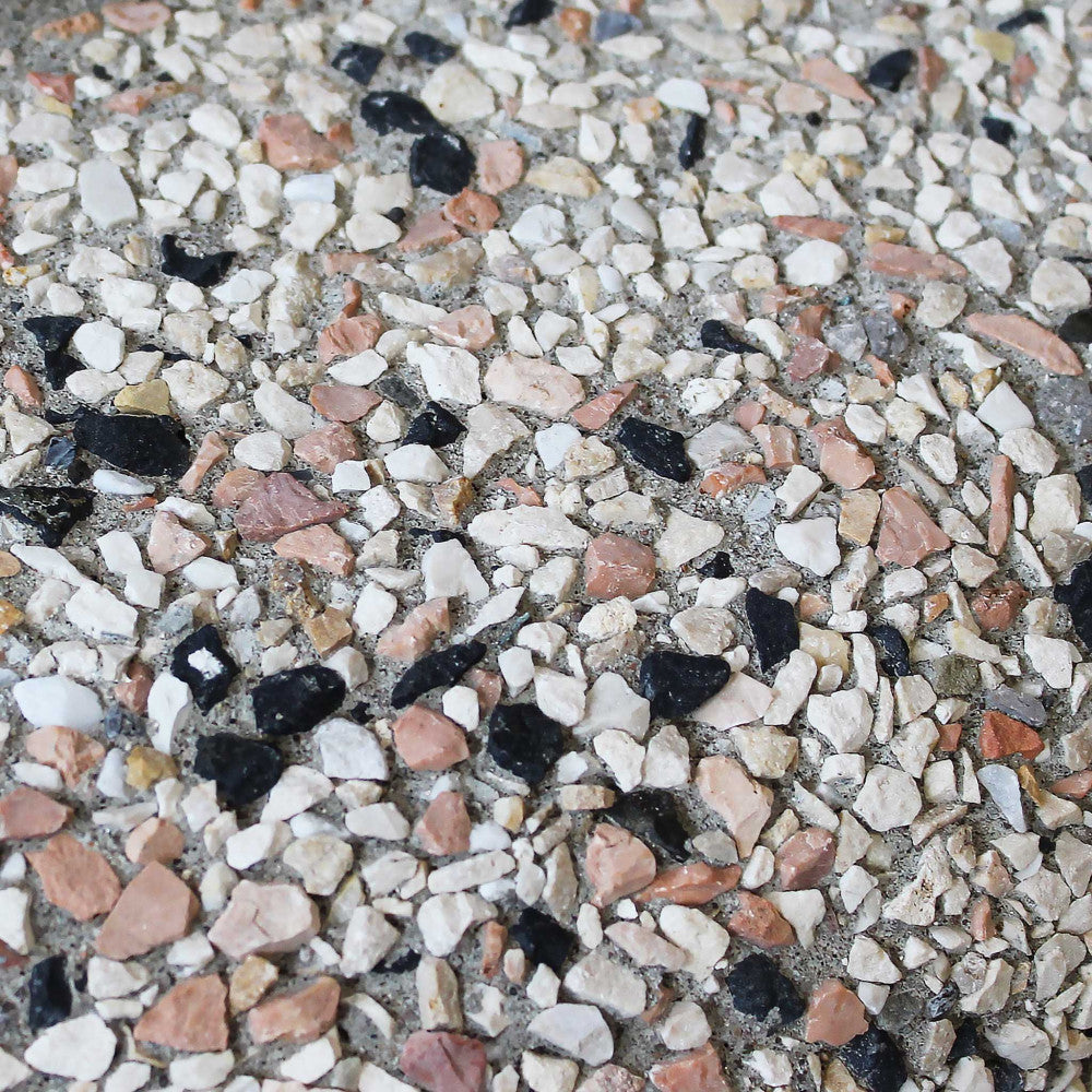 Texture in graniglia visibile della base per ombrellone Cosma
