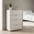 Cassettiera bianca a quattro cassetti MR805065 ambientata in una camera da letto luminosa con dettagli minimalisti.