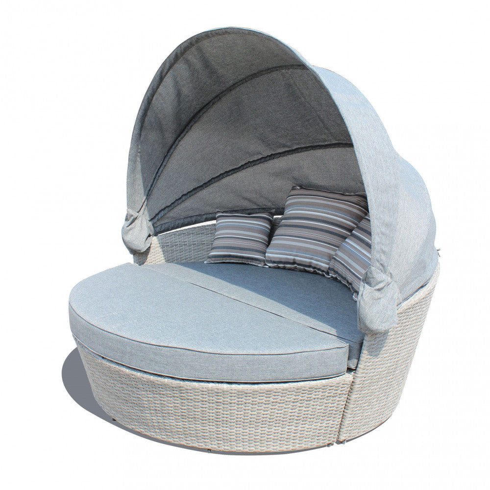 Conchiglione Brasile con struttura in alluminio e rivestimento in wicker grigio con protezione UV, completo di cuscini spessi e cuscini decorativi