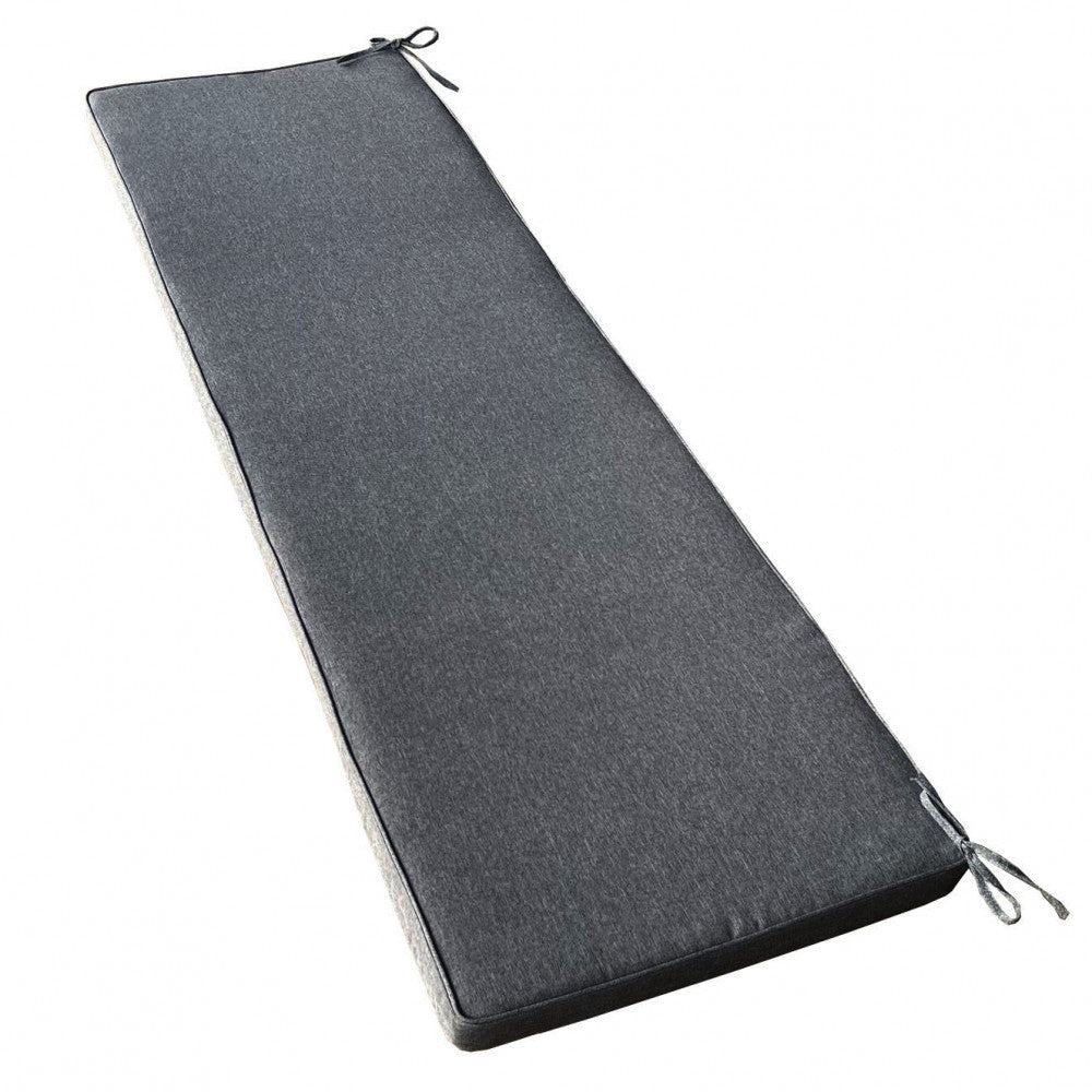 Vista isolata del cuscino Real 150 grigio scuro melange su sfondo bianco, che evidenzia i laccetti angolari e la texture del poliestere.