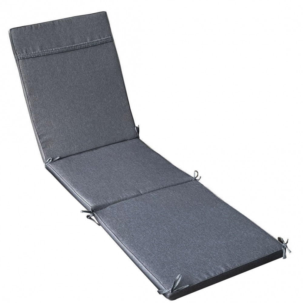 Angolazione laterale del cuscino sfoderabile in poliestere grigio scuro, evidenziando lo spessore e le finiture sartoriali.