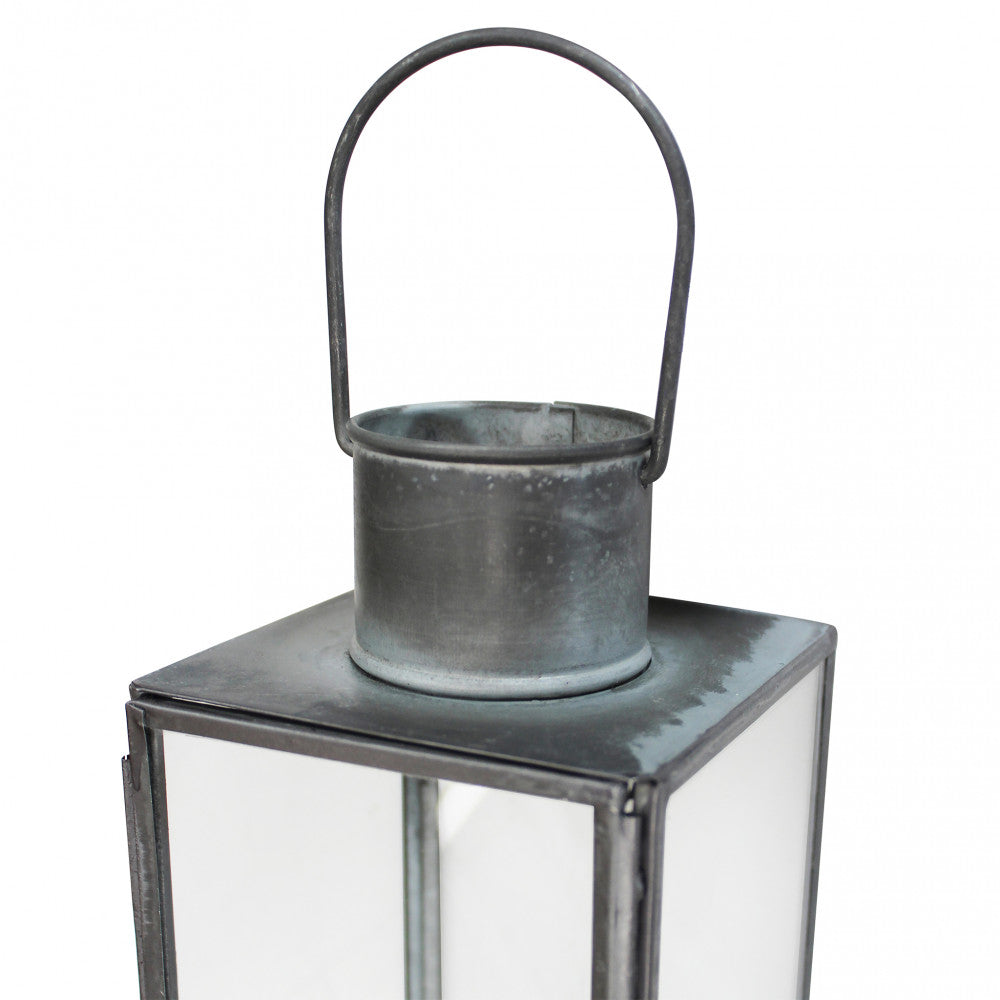 Particolare della maniglia superiore e del profilo in metallo della Lanterna Kaylin Grande.