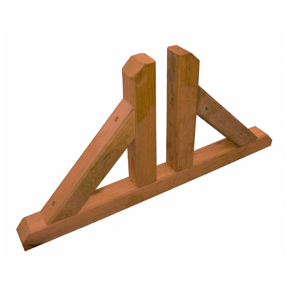 Primo piano del piedino in legno, che mostra la finitura del pino impregnato in autoclave