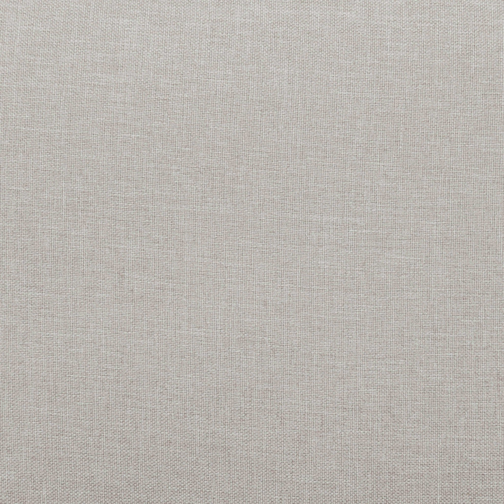 Texture macro del tessuto beige del divano Ramsey, mostrando la trama materica e resistente.