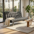 Divano letto Barry a tre posti in tessuto grigio scuro ambientato in un luminoso soggiorno moderno con ampie vetrate.