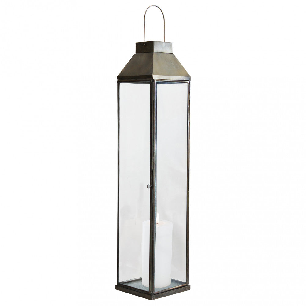 Lanterna Lillian Grande in metallo bronzo con candela accesa, per arredo pavimento vista frontale