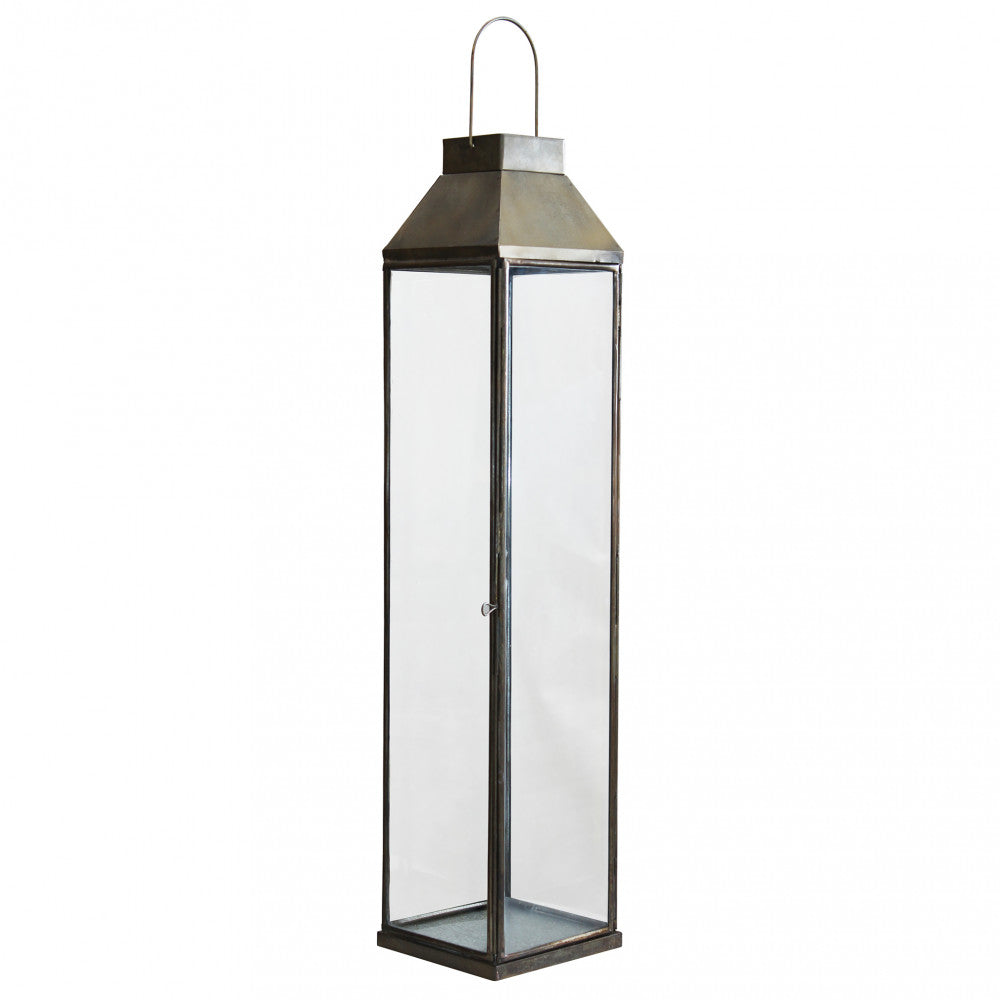 Lanterna Lillian Grande in metallo bronzo con candela accesa, per arredo pavimento.