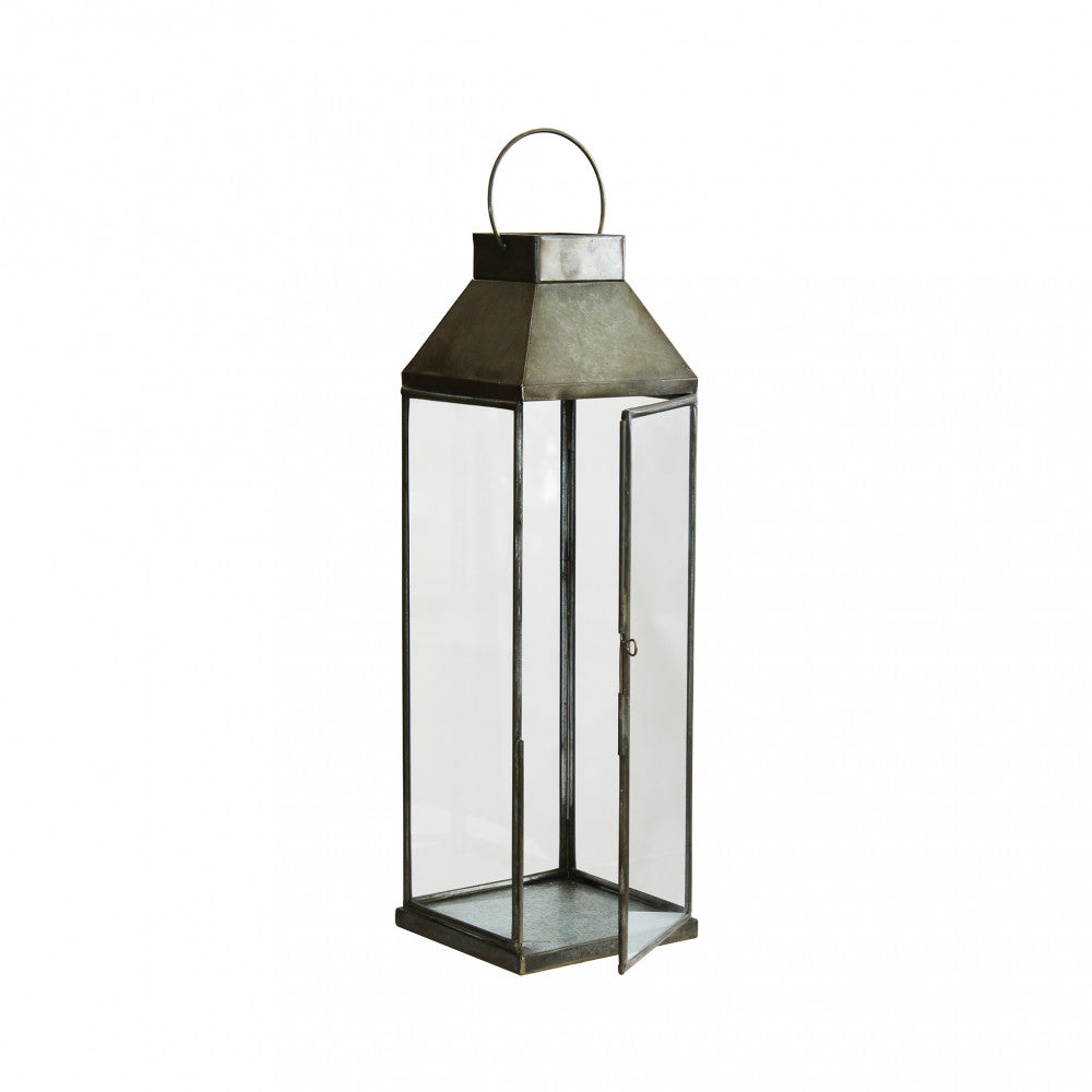 Lanterna Lillian Piccola (47 cm) in metallo bronzo su un tavolo panoramica frontale