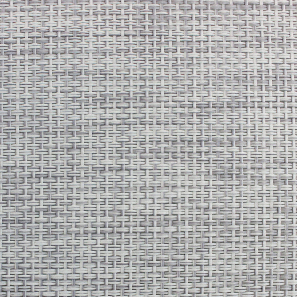 Dettaglio macro della texture intrecciata grigia del rivestimento del lettino, che mostra la trama resistente e il comfort tattile.