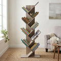Libreria ad albero ARIANE in truciolare bilaminato marrone, allestita con libri in un luminoso soggiorno.