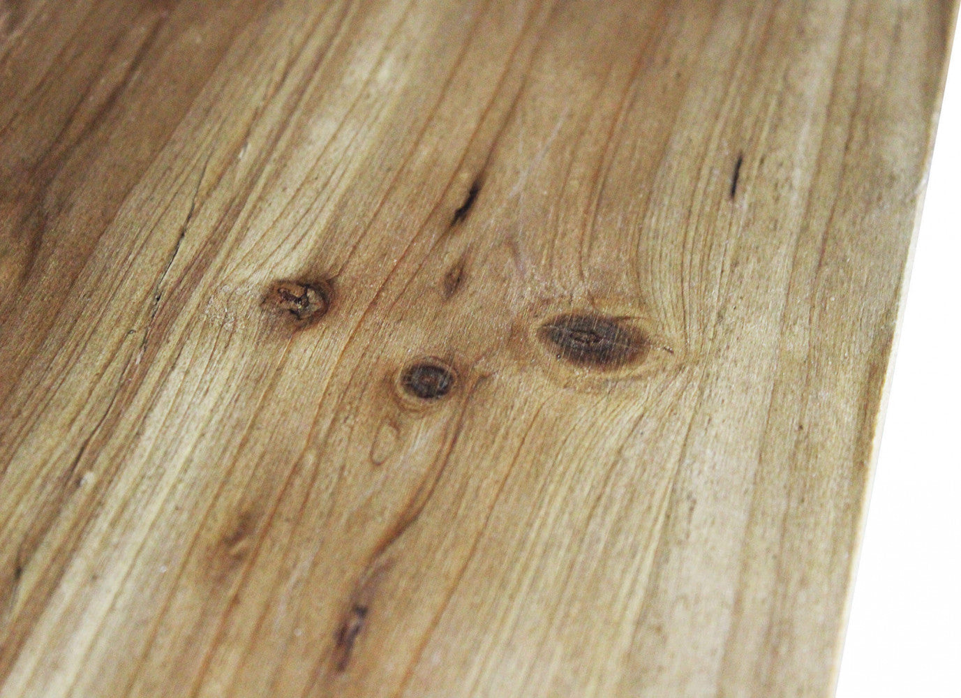 Dettaglio della texture in truciolare bilaminato marrone con venature effetto legno.