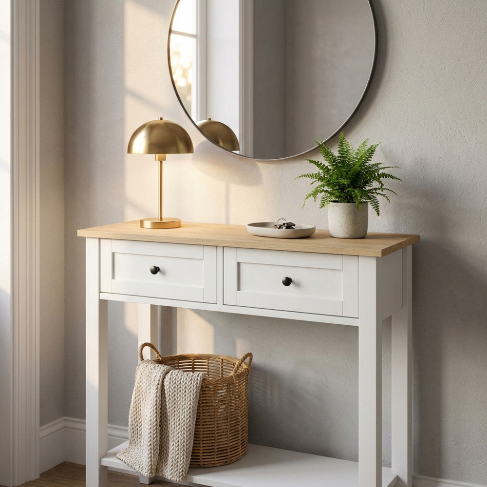 Console ARIC moderna bianca con top in legno naturale, decorata con lampada dorata e pianta verde.