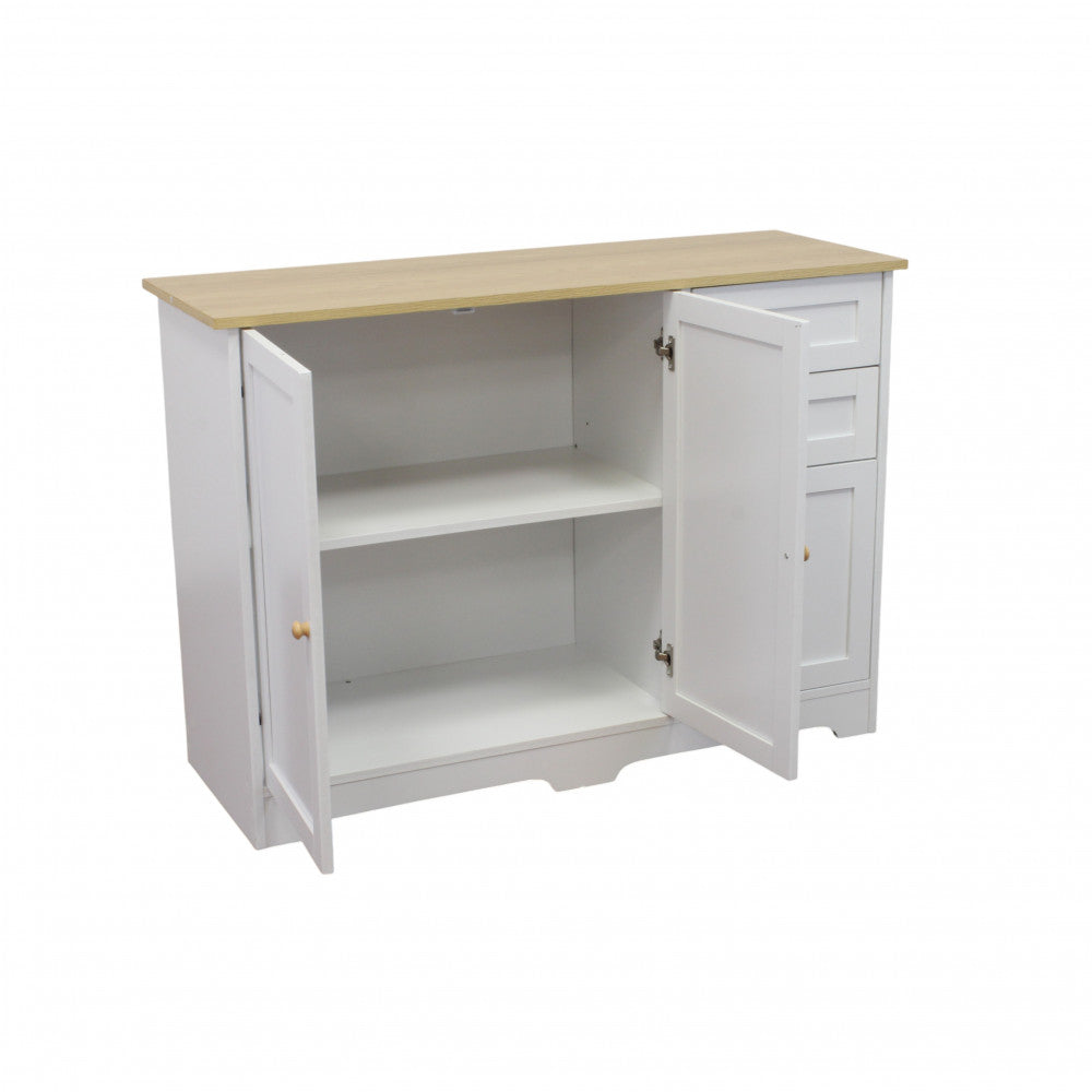 Cassettiera in legno bianco con le due ante di sinistra aperte, rivelando i capienti ripiani interni.