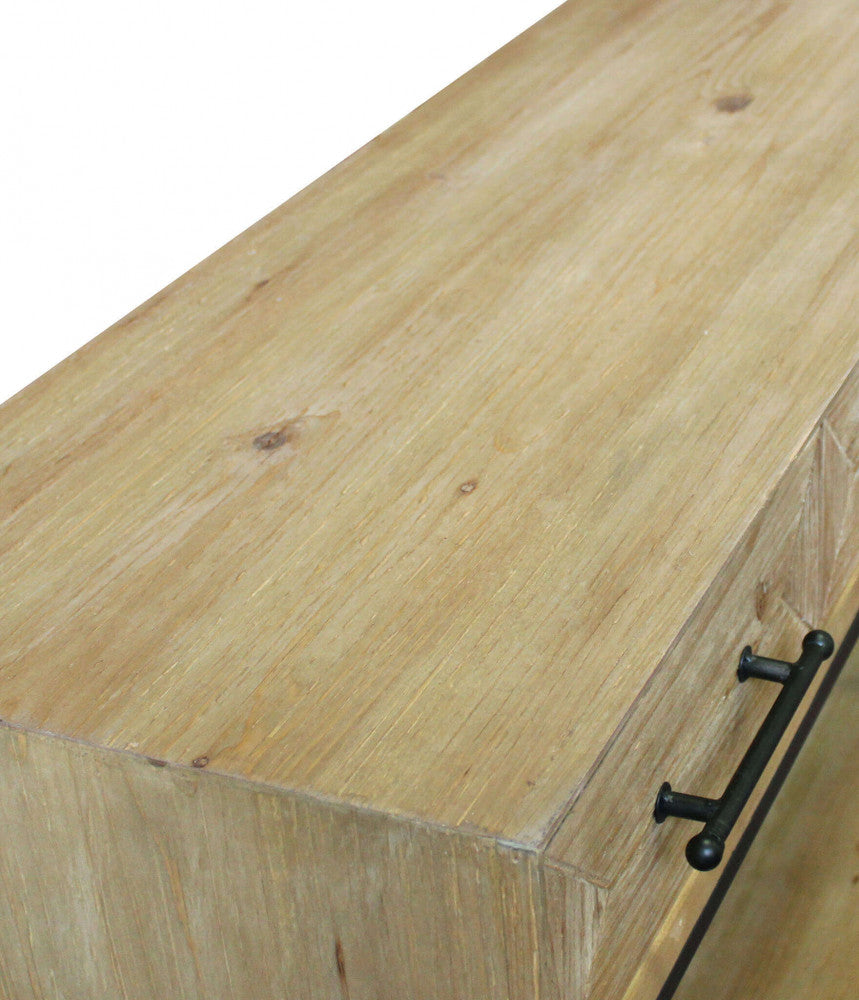 Dettaglio dall'alto della superficie superiore in legno massello, che mostra i nodi naturali e la finitura tattile marrone.