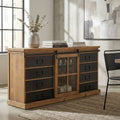 Credenza industriale in legno e acciaio con anta scorrevole centrale e cassetti neri, ambientata in un soggiorno luminoso.