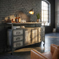 Credenza industriale Emeric in acciaio grigio antracite ambientata in un loft con pareti in mattoni scuri.