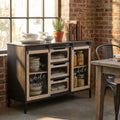 Credenza Florent in acciaio antracite e legno marrone, ambientata in una sala da pranzo in stile industriale con pareti in mattoni a vista.