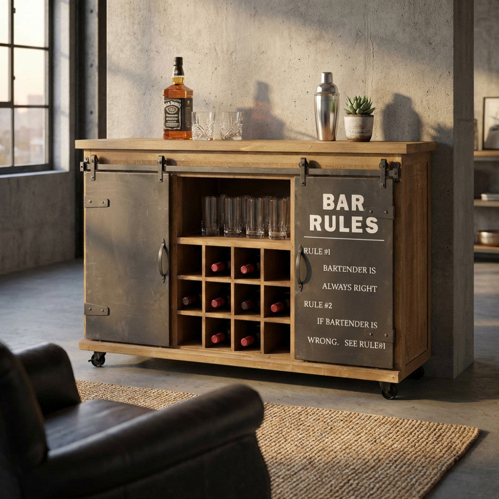 Mobile bar Edmond in legno e acciaio ambientato in un loft industriale con bottiglie e bicchieri a vista.