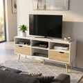 Porta TV Brody in legno bianco e marrone ambientato in un soggiorno luminoso con televisore e decorazioni.