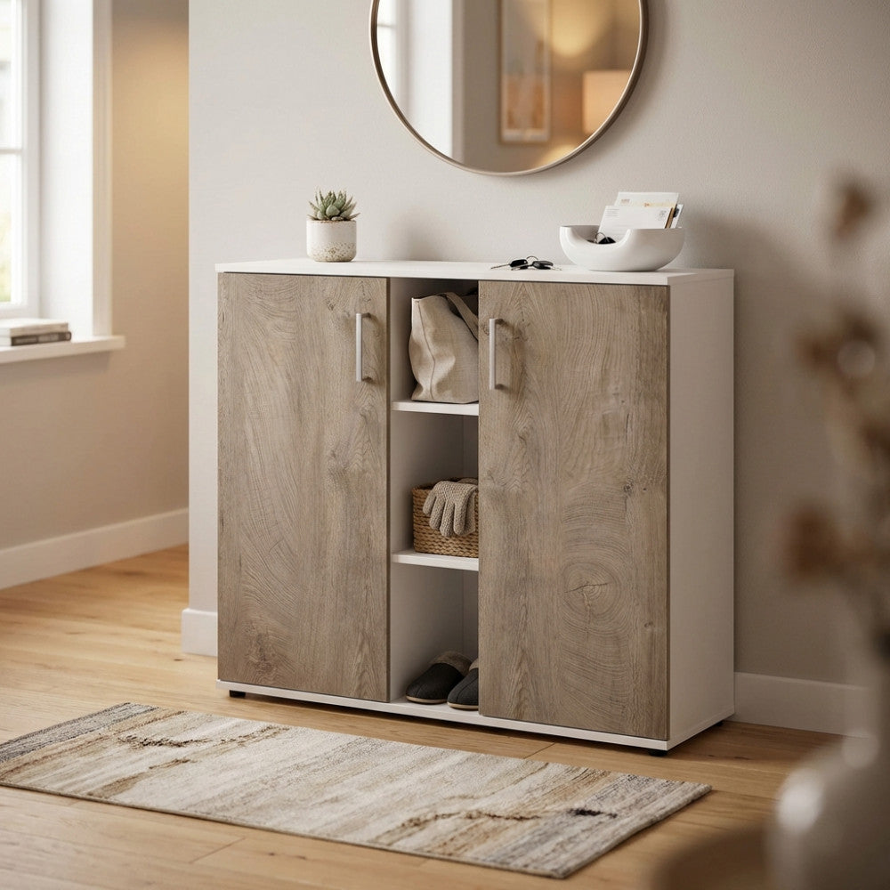 Credenza Frank bianca e rovere chiaro ambientata in un ingresso luminoso con specchio circolare.