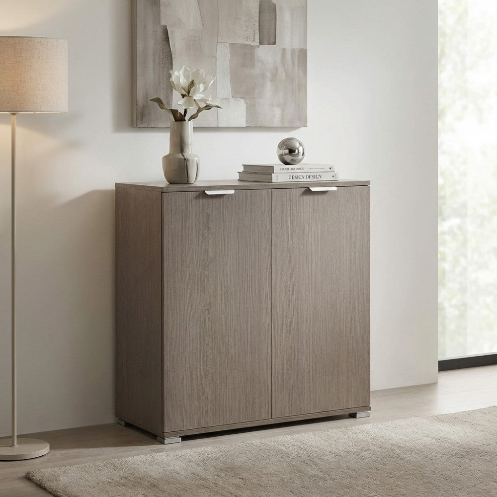 Mobiletto contenitore in truciolare bilaminato rovere grigio decorato con vaso e libri in un ingresso luminoso.