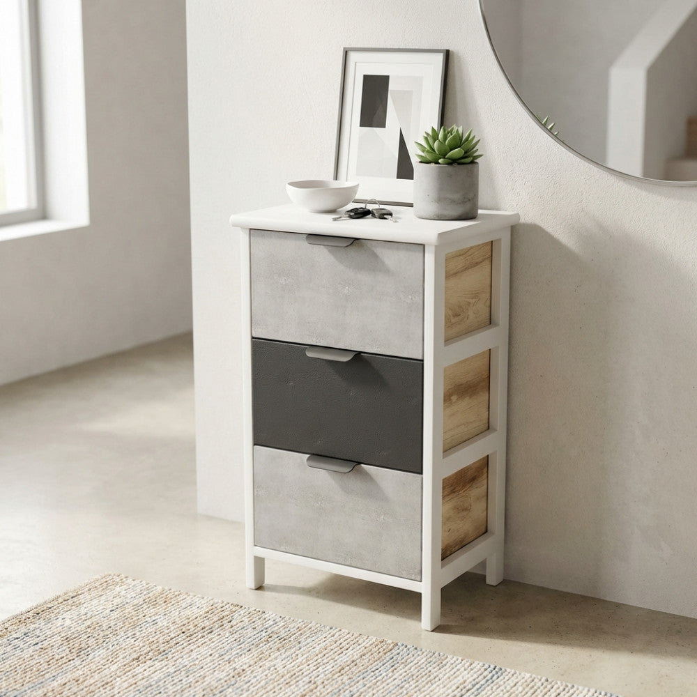 Comodino Casimiro a tre cassetti ambientato in un ingresso luminoso con specchio rotondo e decorazioni minimaliste.