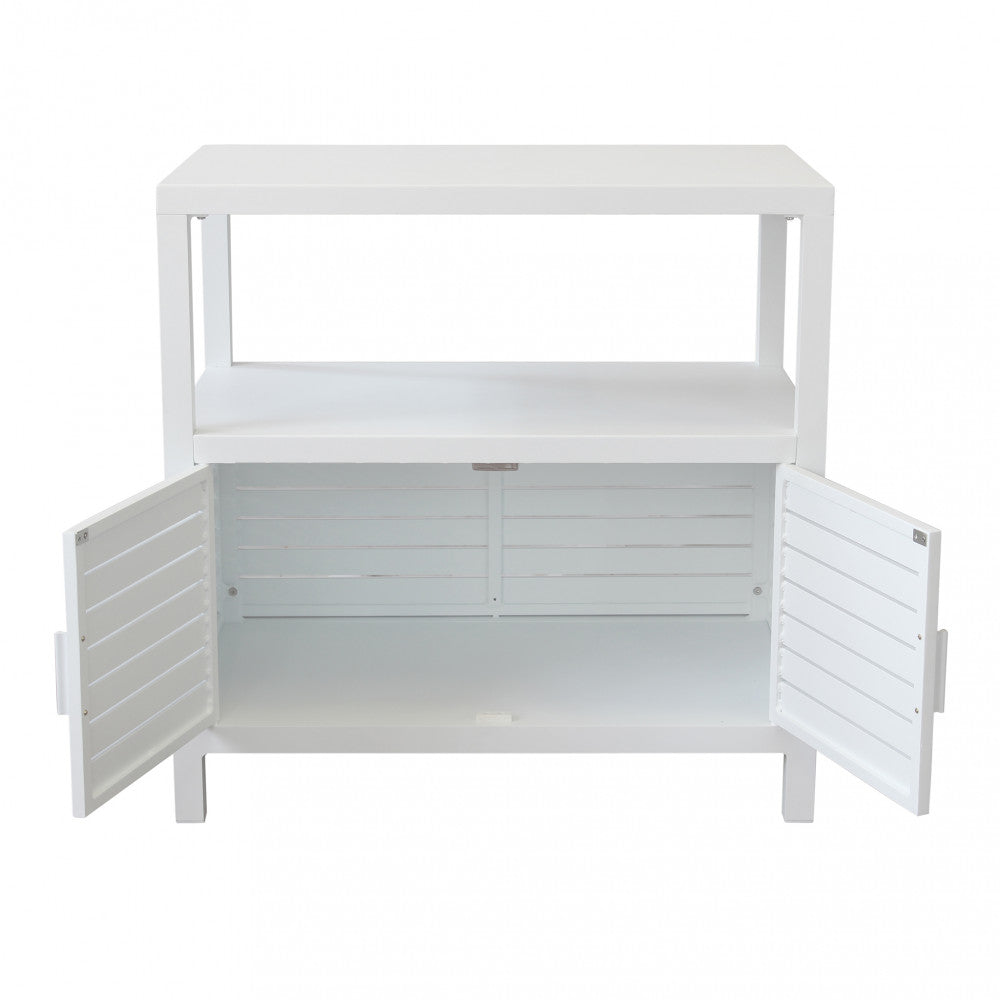 Mobiletto Phoenix bianco con ante inferiori aperte, rivelando l'ampio spazio di archiviazione interno su sfondo neutro.