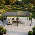 Gazebo modulo per pergola bioclimatica in alluminio antracite allestito con un elegante salotto da esterni.
