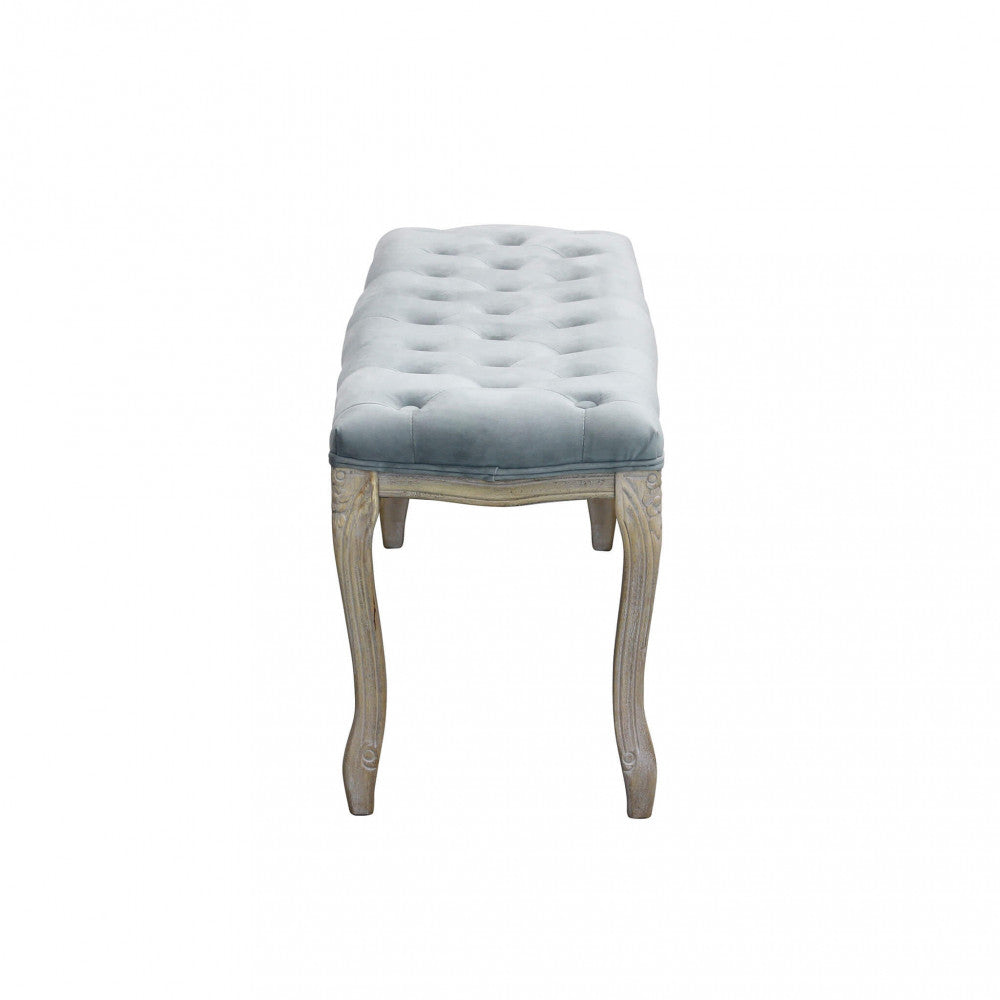 Profilo laterale della panca Misty che mostra la curvatura elegante delle gambe in legno.