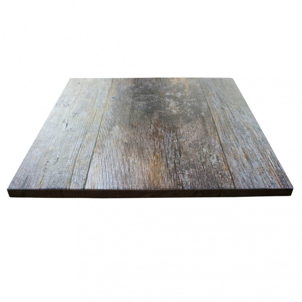 Prospettiva angolare del piano tavolo 70x70 che evidenzia lo spessore e la texture materica.