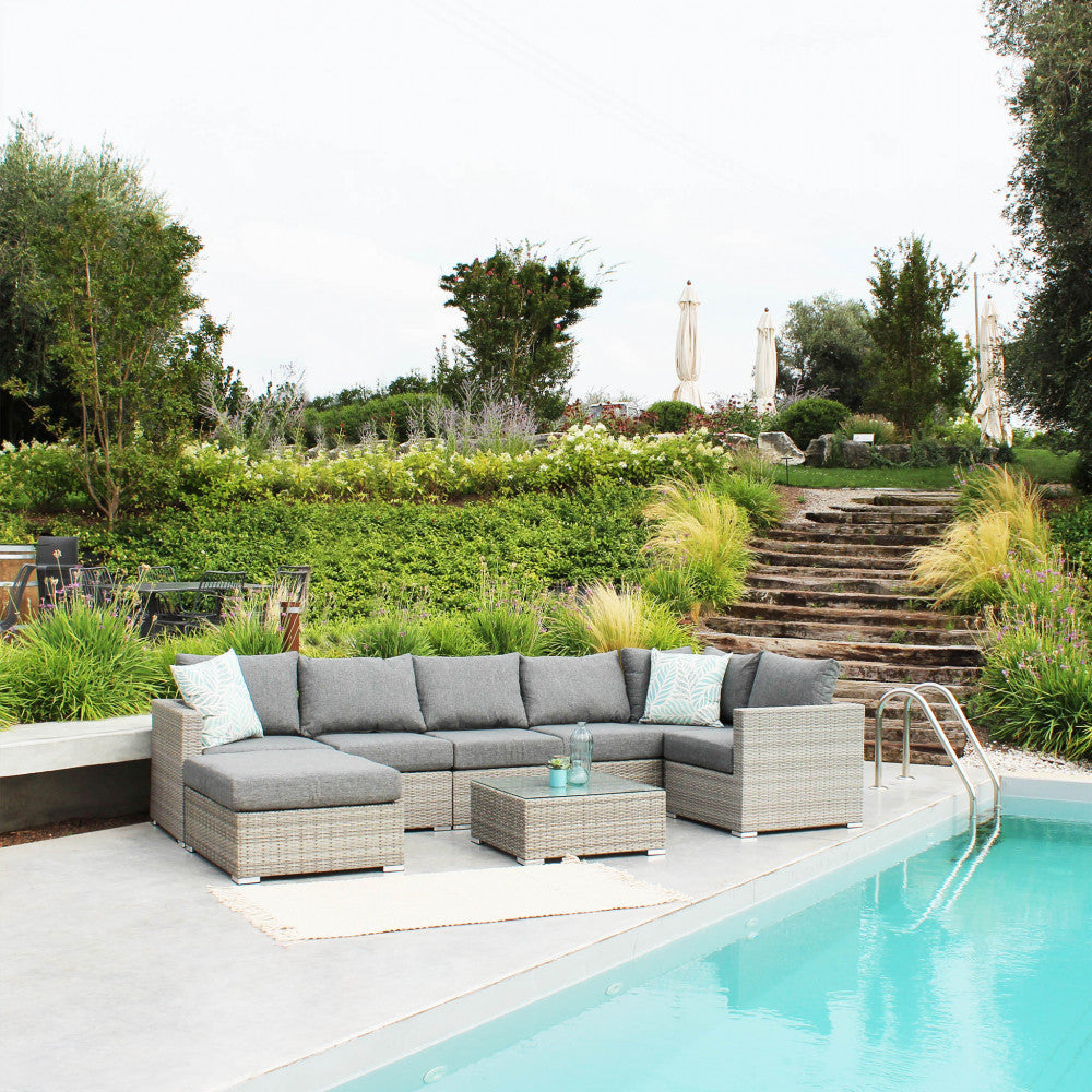 Poltrona angolare Copacabana in alluminio e wicker grigio con cuscini spessi 12 cm.