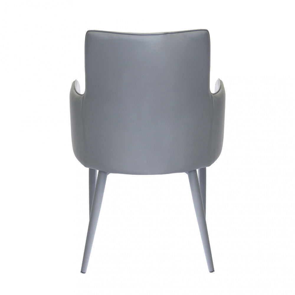 Poltrona Camille Grigio in ecopelle imbottita, inserita in un contesto di salotto moderno vista dal retro