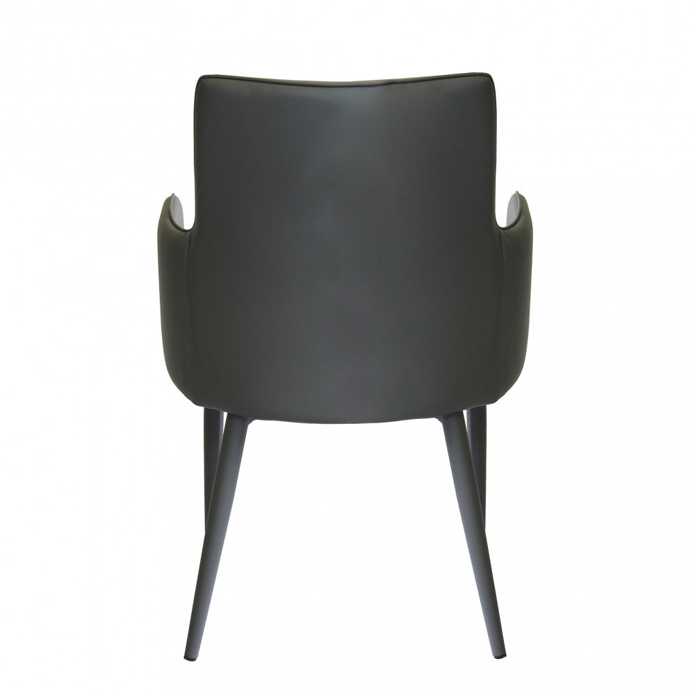 Poltrona Camille Grigio Scuro con braccioli, vista retro in un ambiente di ufficio o studio.