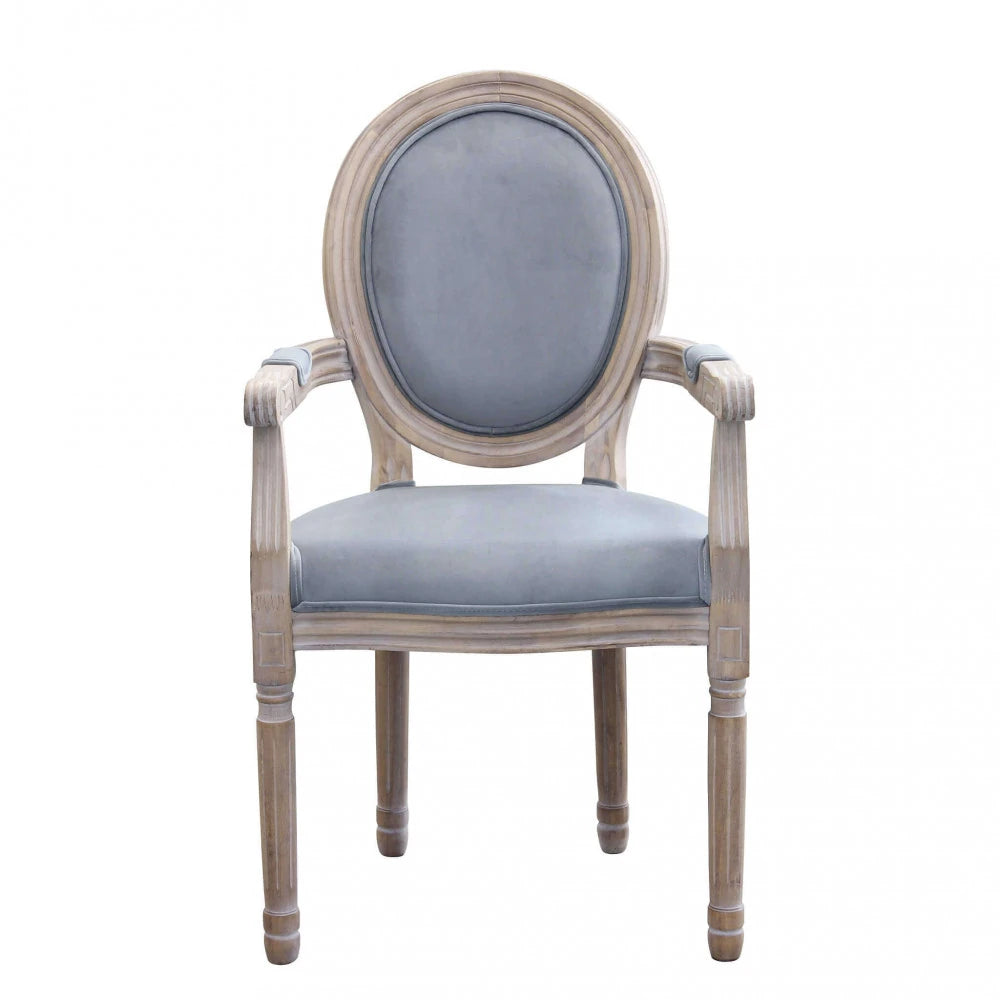 Poltrona Constance in velluto grigio con braccioli, struttura in legno vintage, design moderno vista frontale