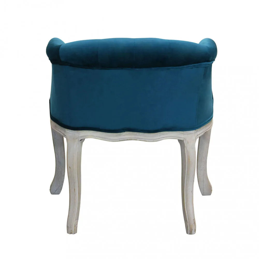 Poltrona Coreen in velluto blu con braccioli e struttura in legno 61cm profilo retro