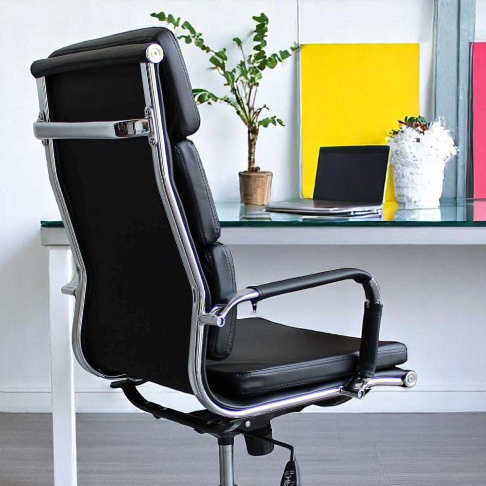 Profilo posteriore della seduta ergonomica in un ufficio luminoso con dettagli cromatici vivaci.