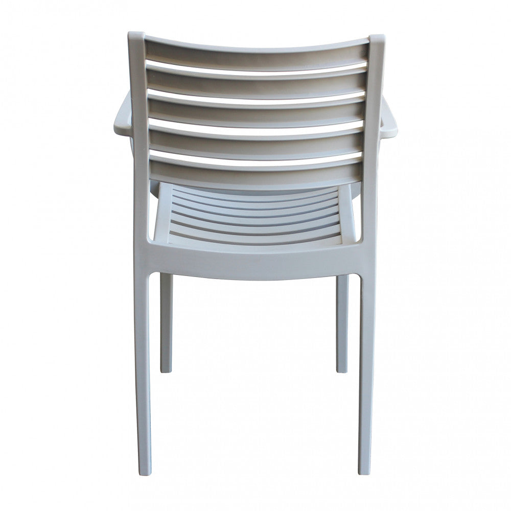 Vista posteriore della Poltrona Eveline in polipropilene grigio, che mostra la struttura di supporto e il design continuo delle doghe.