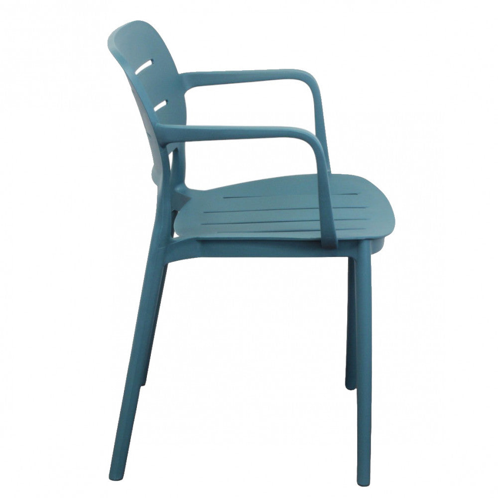 Profilo laterale della poltrona Giselle verde petrolio, che sottolinea l'inclinazione ergonomica dello schienale.