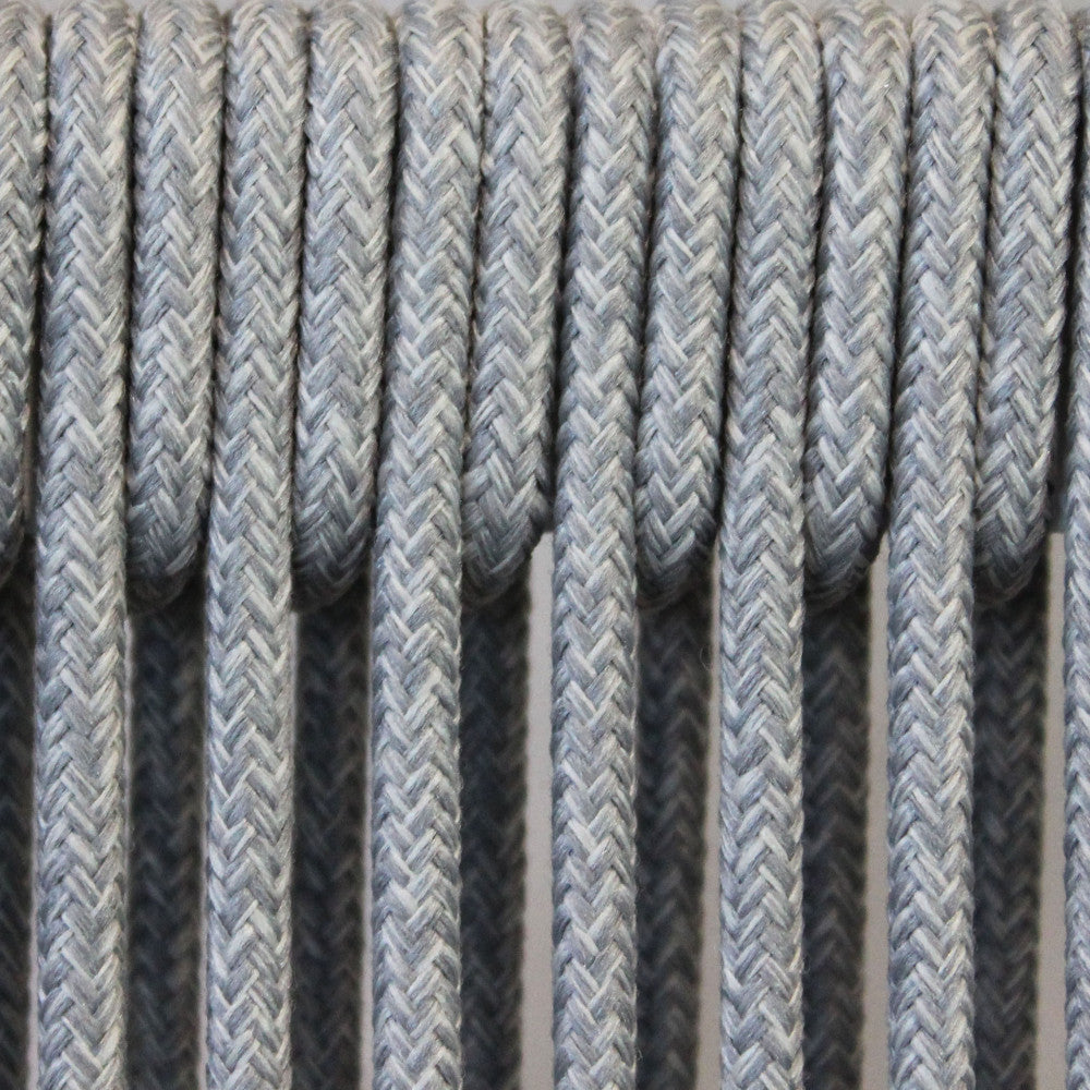 Macro fotografia della texture in corda di poliestere beige resistente agli agenti atmosferici.