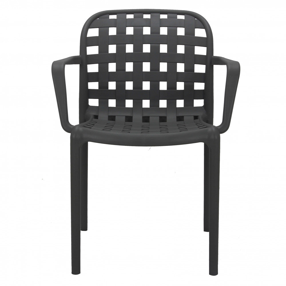 Poltrona Sharon colore Antracite, design elegante con braccioli, in ambiente minimalista.