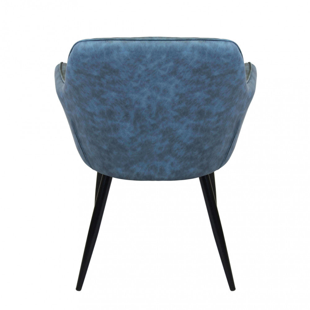 Vista posteriore completa della Poltrona Sindy in ecopelle blu, con focus sulla struttura delle gambe in metallo nero.
