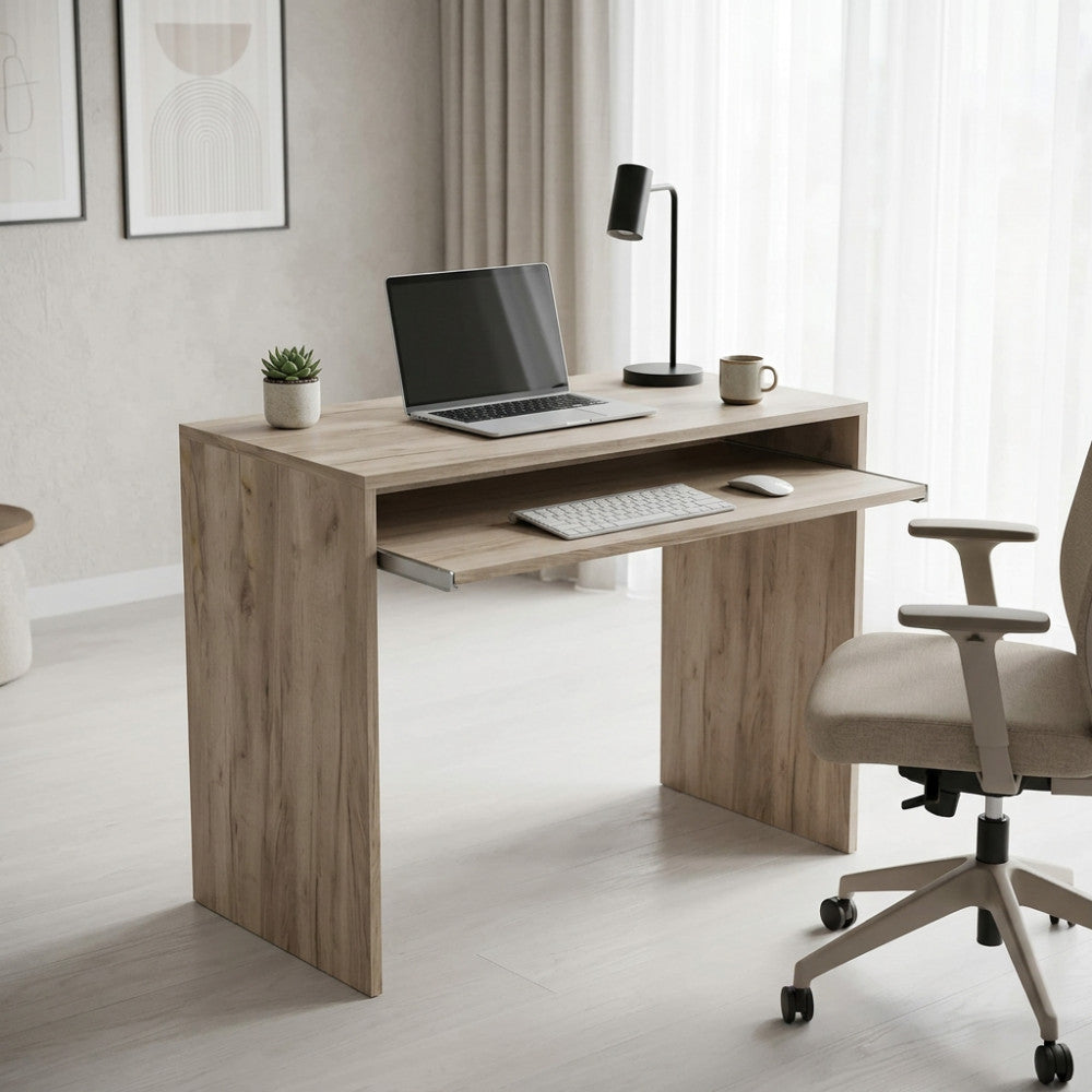 Scrivania porta PC Perry Olmo in rovere grigio ambientata in un luminoso home office con sedia ergonomica.