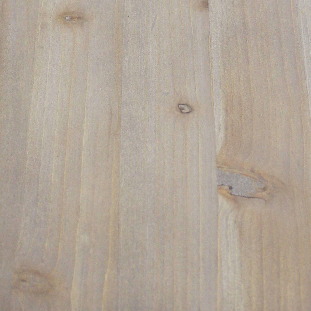 Dettaglio macro della finitura materica del pannello superiore in MDF, con sfumature calde e venature realistiche.