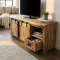 Porta TV Weldon in legno marrone con anta scorrevole aperta e cassetto estratto in un salotto luminoso.