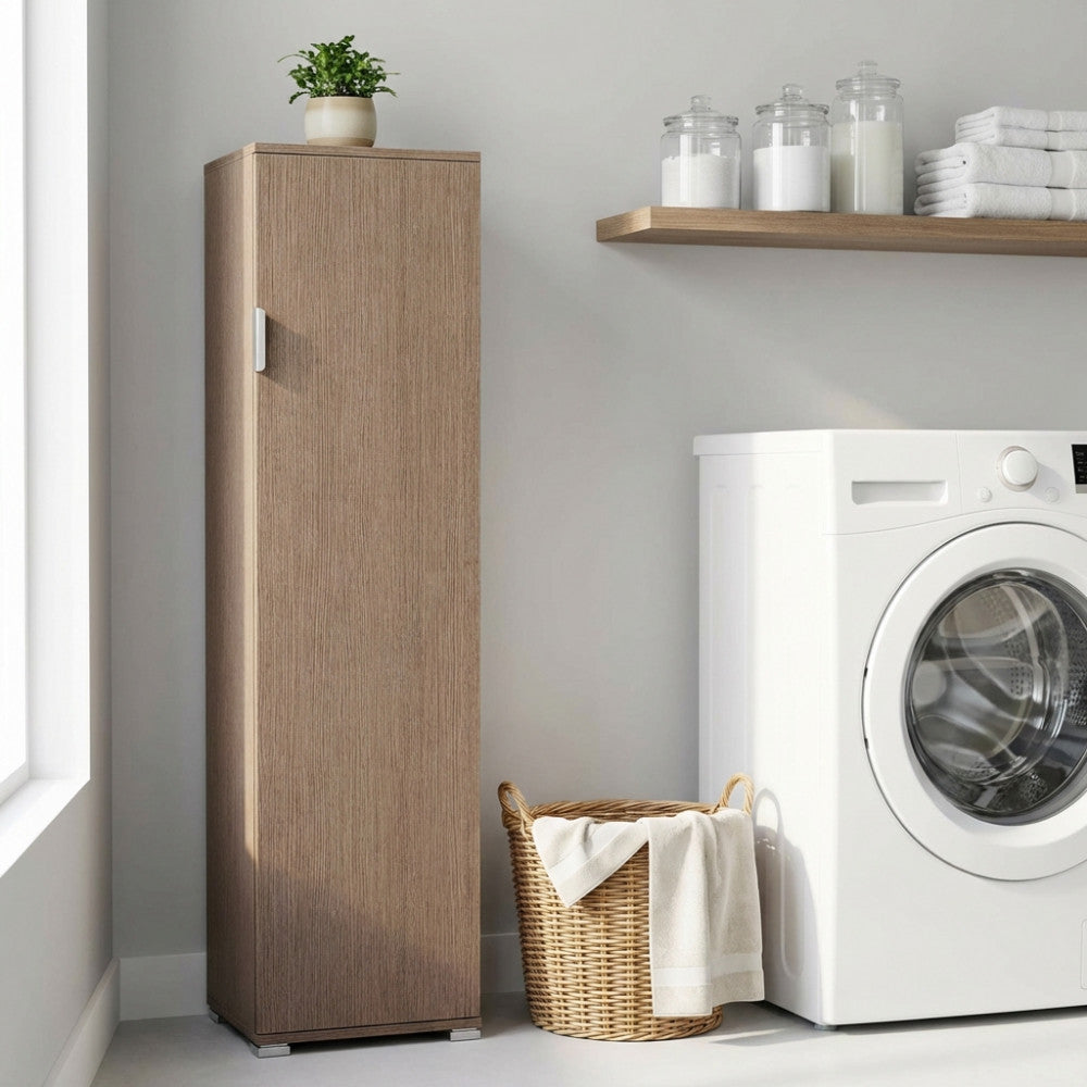 Mobile portascope in rovere grigio ambientato in una lavanderia moderna accanto a una lavatrice bianca.