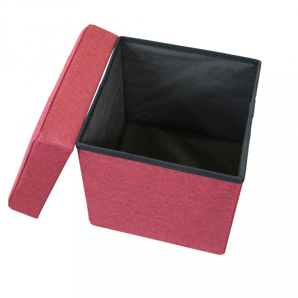 Pouf contenitore aperto con coperchio sollevato, mostrando l'ampio vano interno foderato in tessuto scuro.