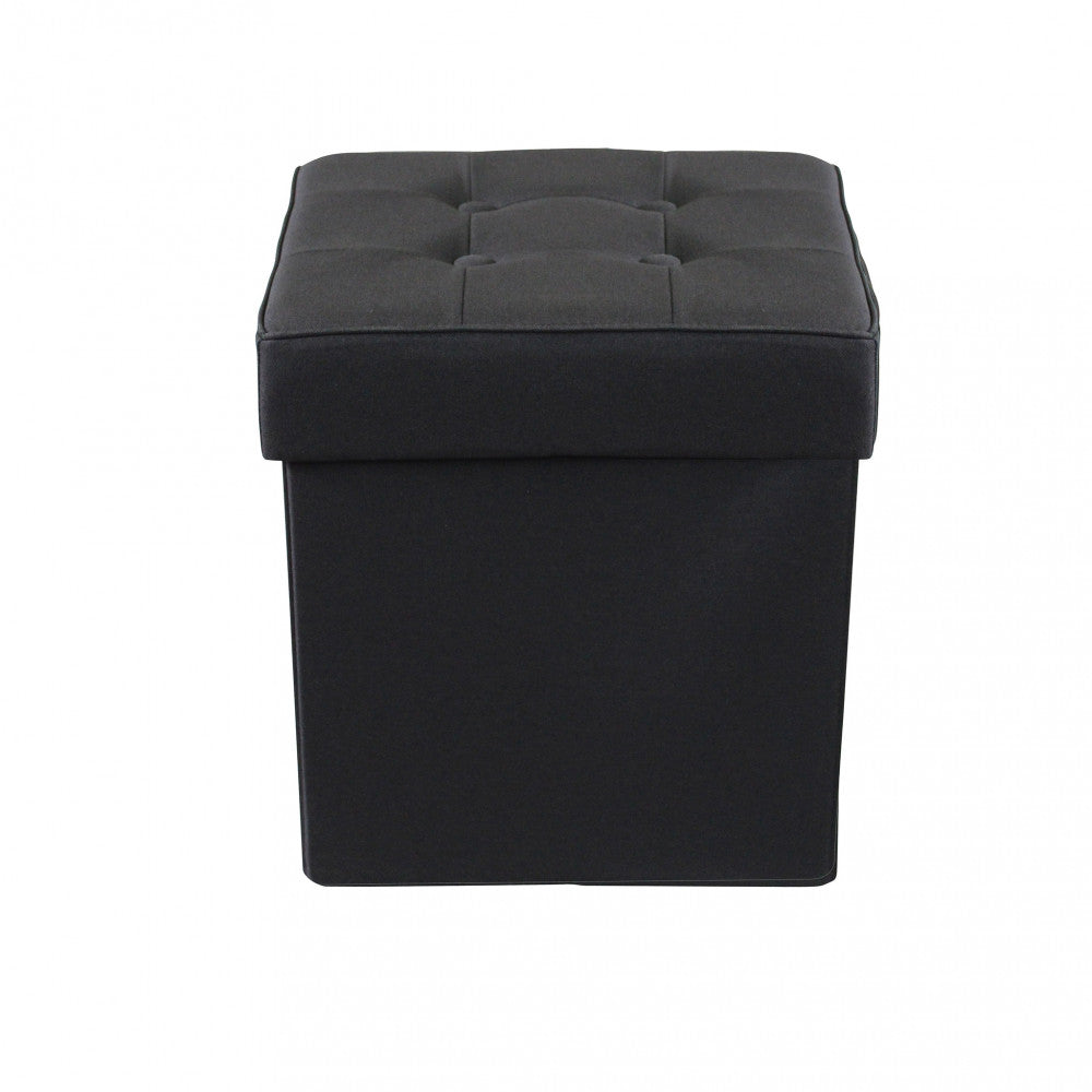 Vista frontale del pouf contenitore chiuso in tessuto nero dalle linee geometriche.
