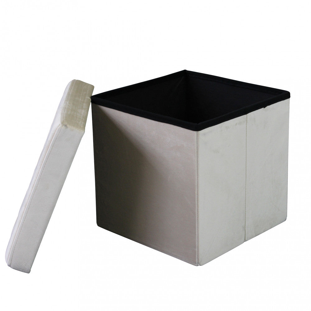Pouf contenitore quadrato aperto con il coperchio appoggiato a lato, evidenziando lo spazio contenitivo nero.